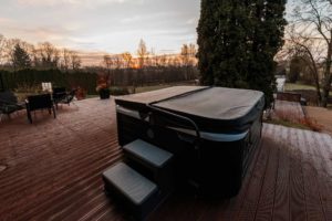 Hot tub on a backyard deck showing the care needed for safe hot tub moving